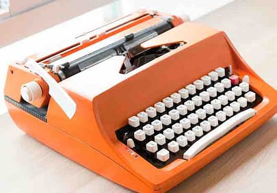 Orange-typewriter-used-in-overcoming-writers-block